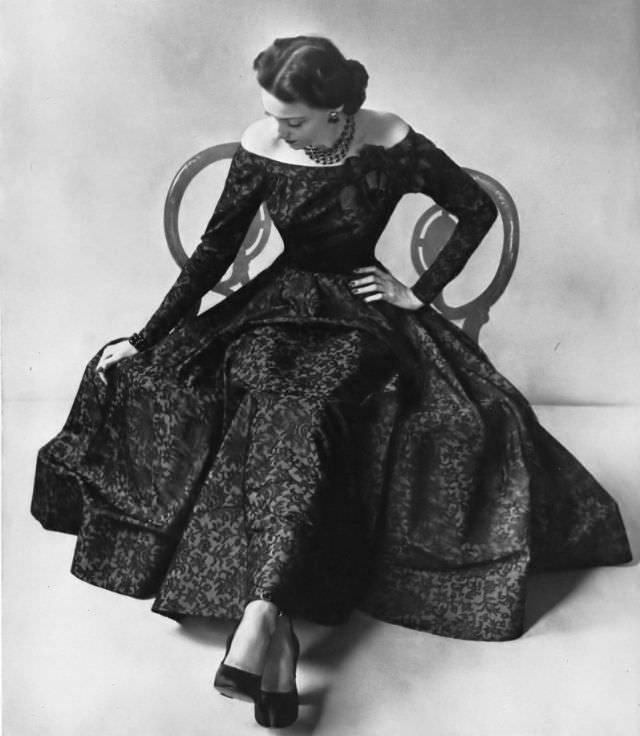 #21 Model in black Chantilly lace filigreed on rayon taffeta in this gown with a very full skirt by Ben Reig for Saks Fifth Avenue, Vogue, 1947.