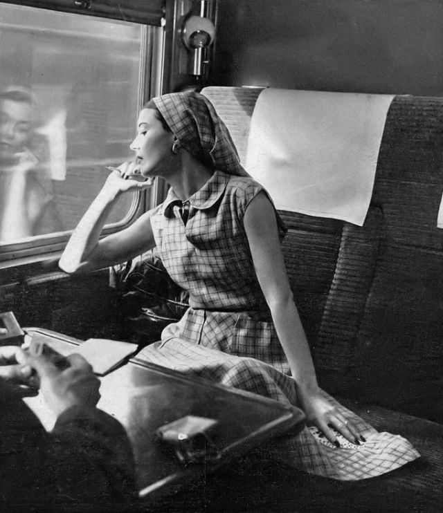 #23 Model in ideal travel dress of a cool tattersall-checked linen in red and white on tan by Henry Rosenfeld, Harper’s Bazaar, 1947.