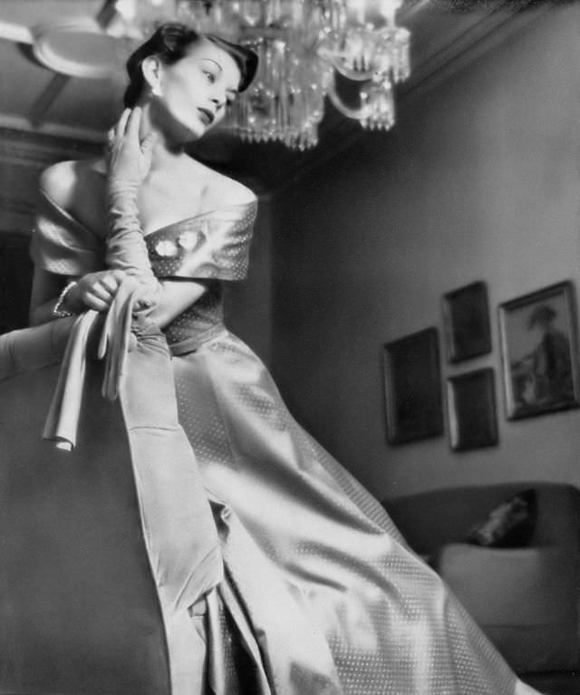 #27 Betty Bridgers in dotted mauve satin gown by Larry Aldrich, jewelry by Eisenberg, Harper’s Bazaar, 1948.