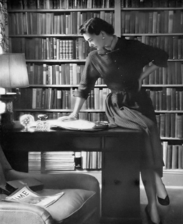 #32 Marilyn Ambrose in black and brown checked wool dress by Ken Classics, Harper’s Bazaar, 1948.