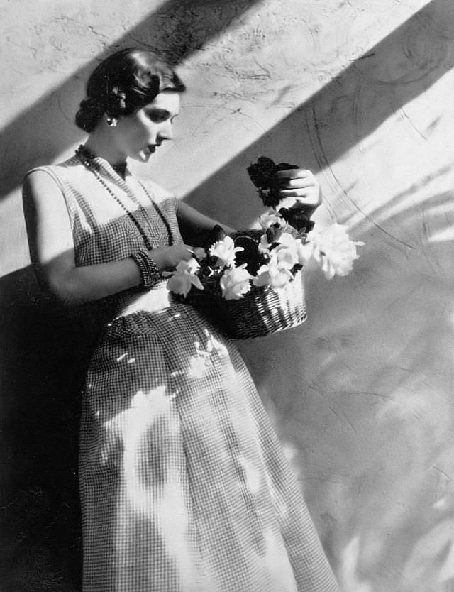 #36 Model in charming dress of red and white checked sheer cotton by Nelly Don, Harper’s Bazaar, 1948.