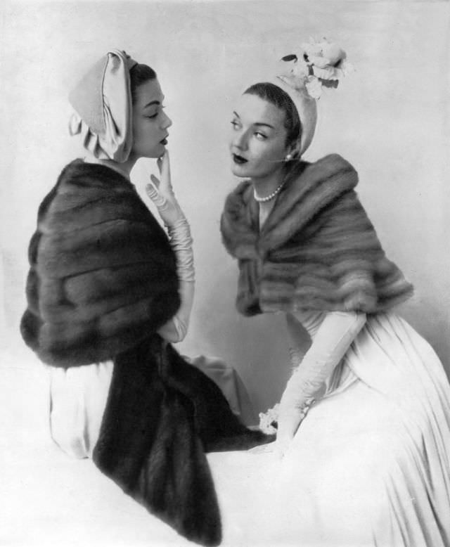 #43 Jean Patchett in Royal Pastel mink stole and model in Silver Blue mink mantlet with convertible shoulder-cuff by Bergdorf Goodman, Vogue, 1949.