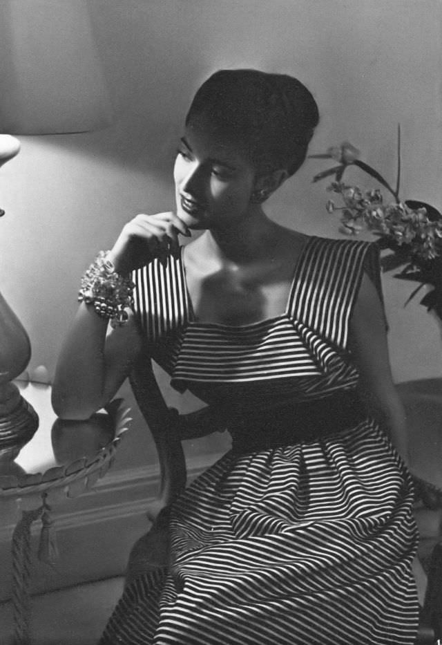 #5 Model in a pink-and-black striped piqué party dress by Capri, Vogue, 1945.