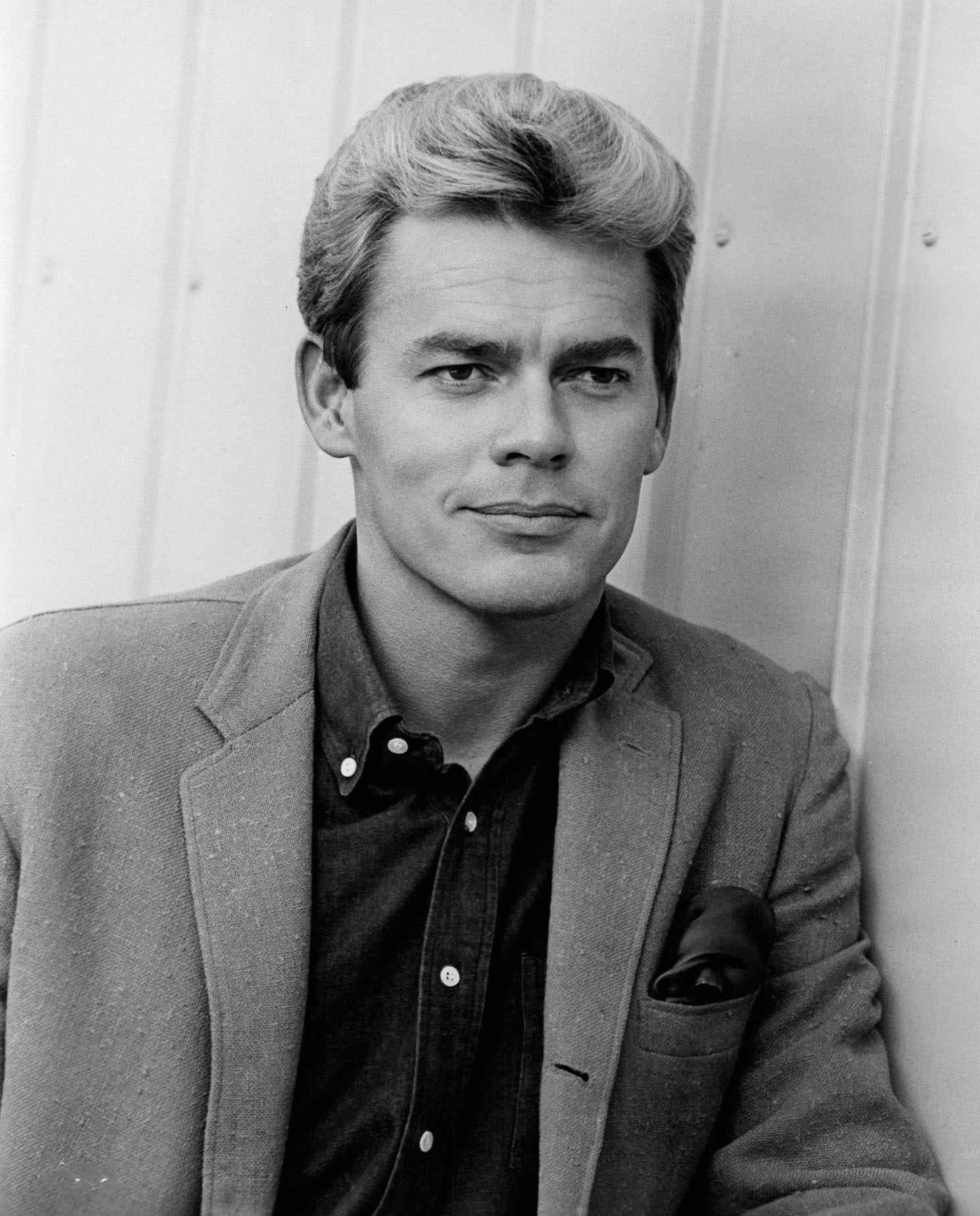 James Ward standing near wall in a scene from the film ‘Kitten With A Whip’, 1964