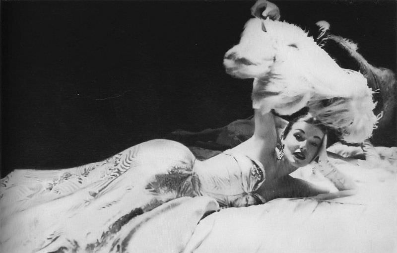 #10 Liz Pringle in Strapless evening gown of white and gold satin print by Howard Greer, Harper’s Bazaar, October 1950