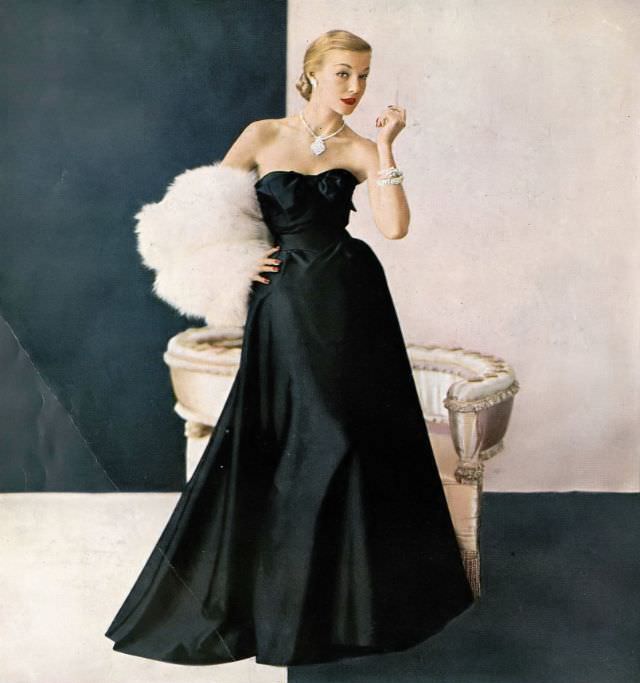 #16 Liz Pringle in satin faille and Enka rayon evening gown by Maurice Rentner, fox fur by Fredrica, jewlery by Kramer, October 1951