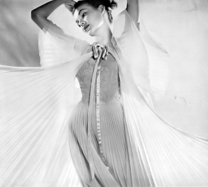 #21 Liz Pringle in lovely ice-blue peignor set of pleated nylon and ecru lace by Vanity Fair, June 1952
