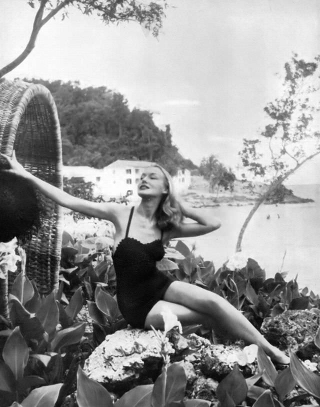 #35 Liz Pringle in one-piece black cotton bathing suit by Sacony at Round Hill, Jamaica, 1954