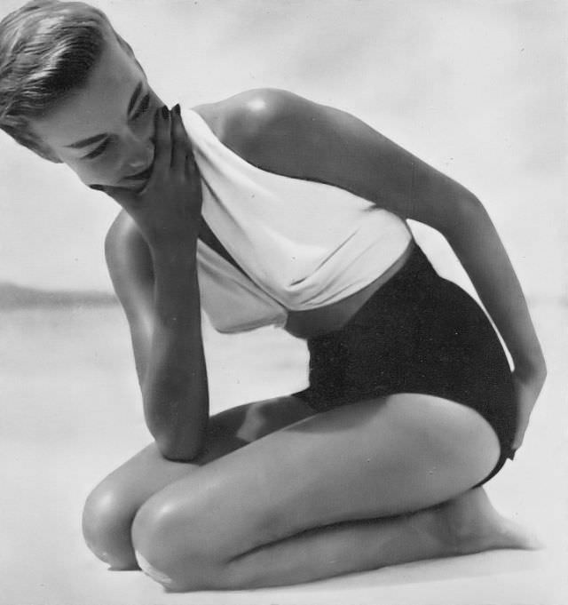 #5 Liz Pringle in white halter top and black brief bottoms, Harper’s Bazaar UK, June 1949