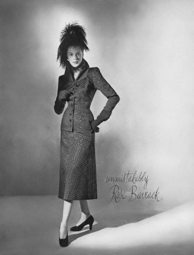 #26 Meg Mundy in late-day suit by Rose Barrack, hat by John Frederics, Vogue, September 15, 1947