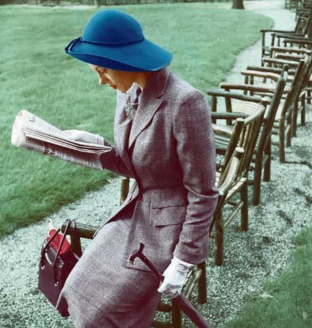 #36 Meg Mundy is wearing grey muted plaid wool suit with teal blue hat, 1947