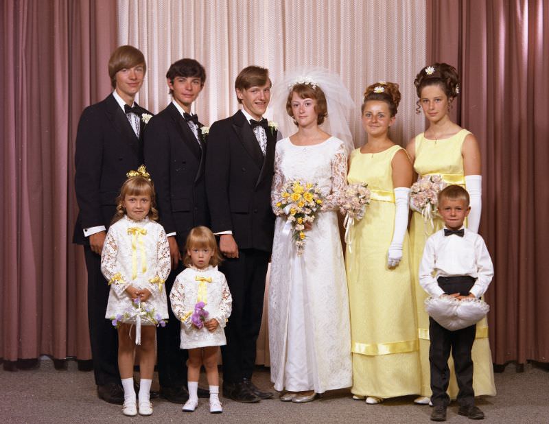 #6 Wedding portrait of Mr. Verigin and Mrs Robert. The bride is holding a bouquet of yellow flowers, August 15, 1970