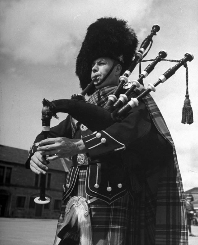 #7 In full dress, a piper of the famed Black Watch regiment piped a pibroch at Perth Barracks.