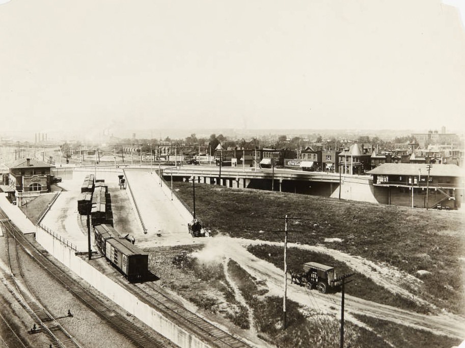 #141 Tower Grove viaduct bridge in Midtown in 1920. Horses pull work carts in the center of the photo.