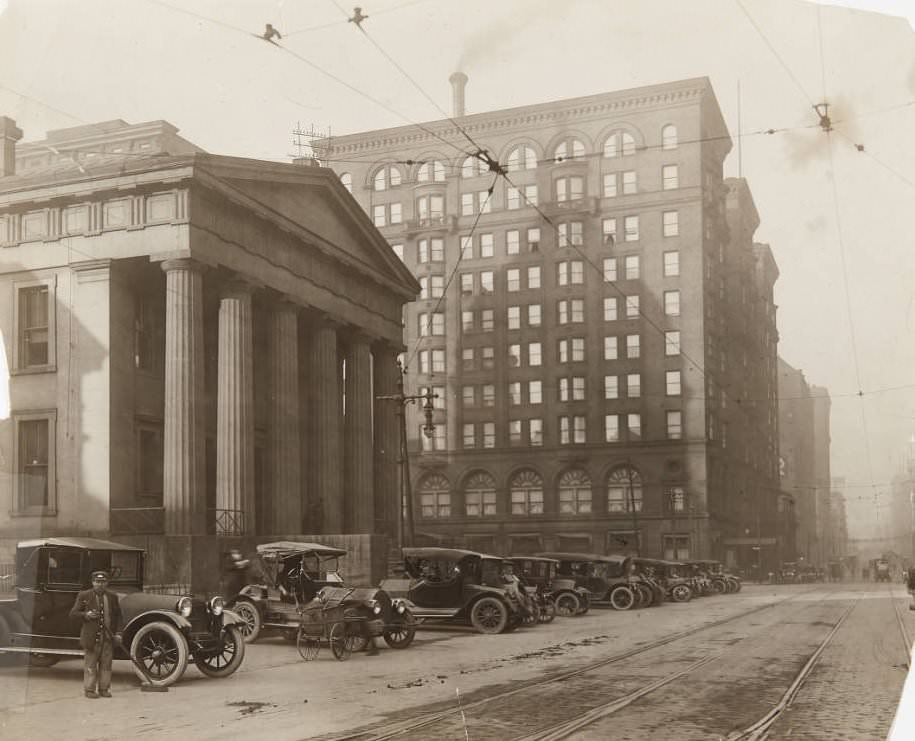 #154 A row of cars parked in front of the Old Courthouse on Fourth Street in 1920.