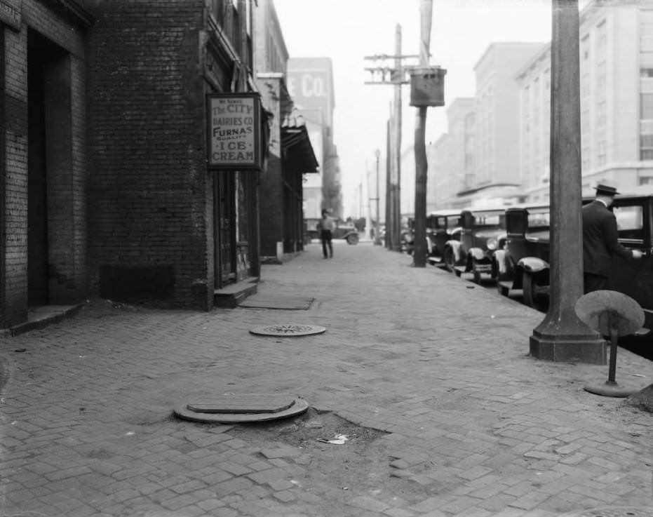 #178 North view from 413 South Broadway towards the intersection with Spruce Street, with the Steinwender-Stoffregen Coffee Co. building at far center and Busch Stadium, 1925
