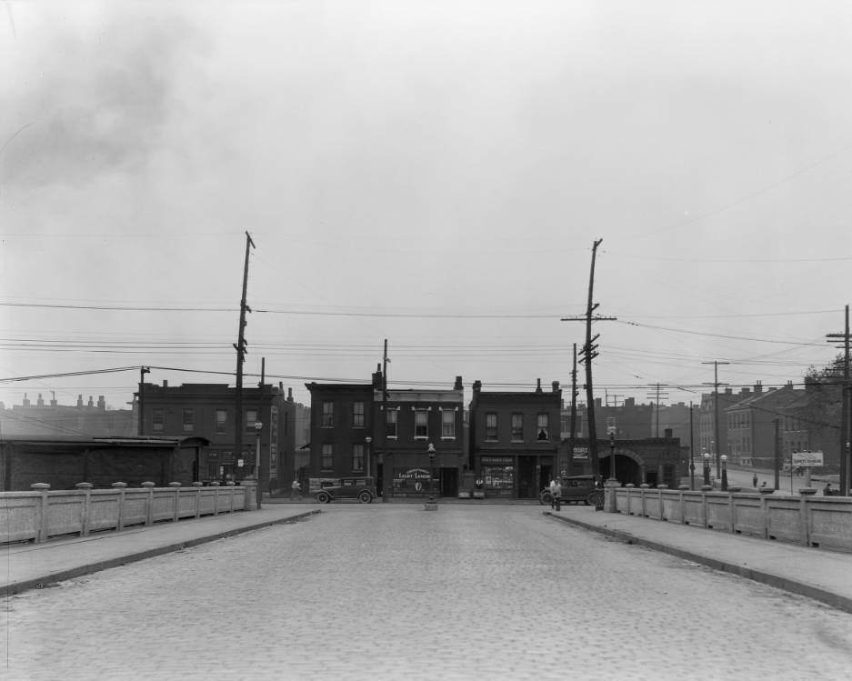 #190 View from South Compton of several buildings on Chouteau Ave., including Dr. Eugene T. Taylor office and pharmacy, 1925