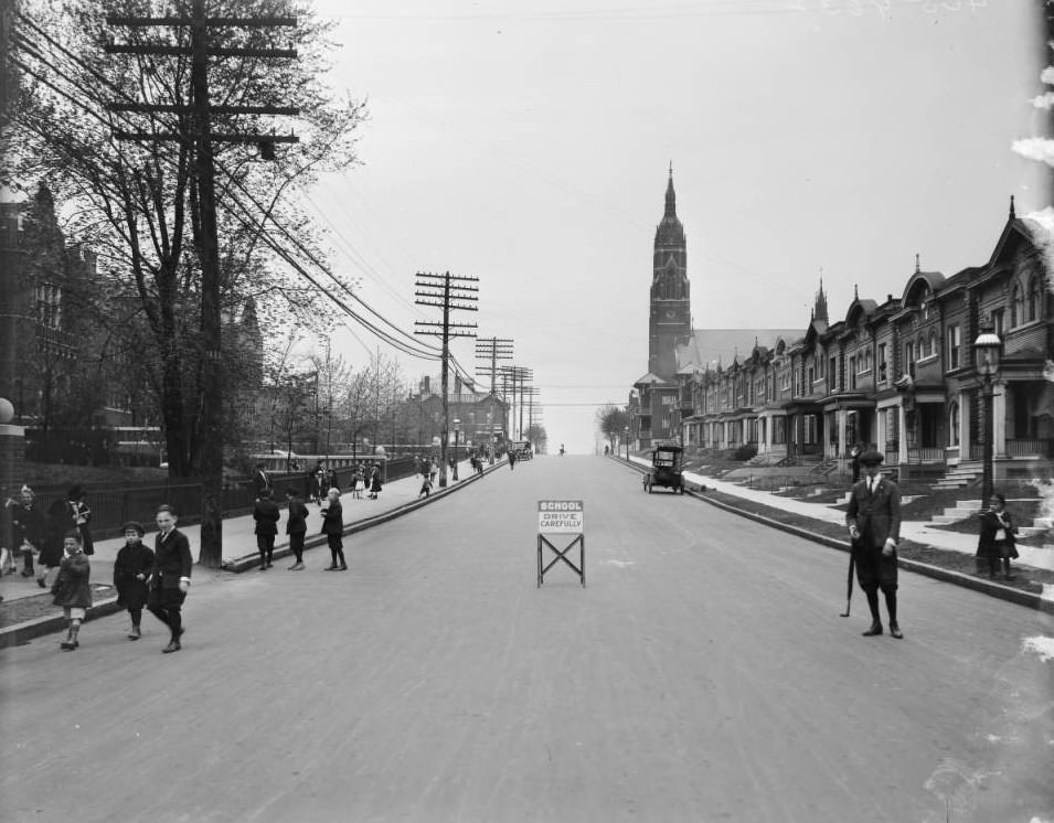 #67 View of children walking towards Hempstead School from the center of Minerva at Laurel, 1925