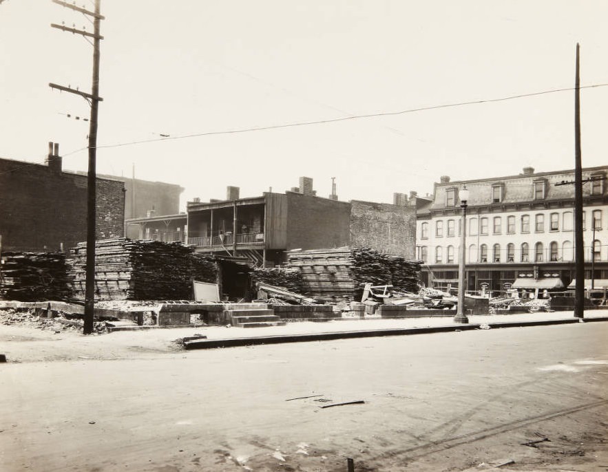 #89 Stacks of lumber piled in a lot near the intersection of 23rd Street and Franklin Avenue, 1920