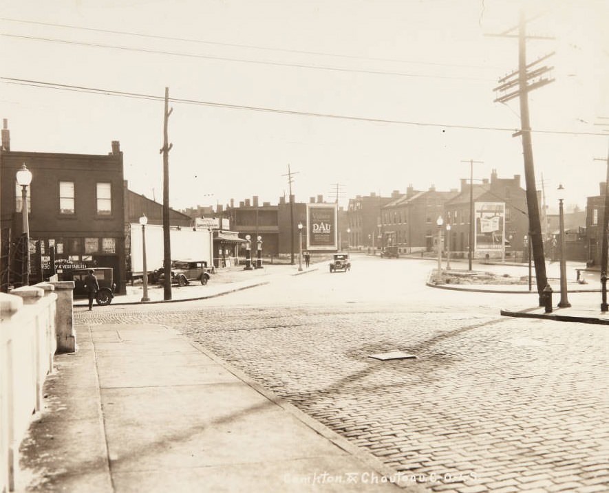 #20 Intersection of Compton and Chouteau avenues looking south on Chouteau, with the Compton Grocery and Vegetables store and the Lubrite gas station visible on the eastern side of the street, 1920