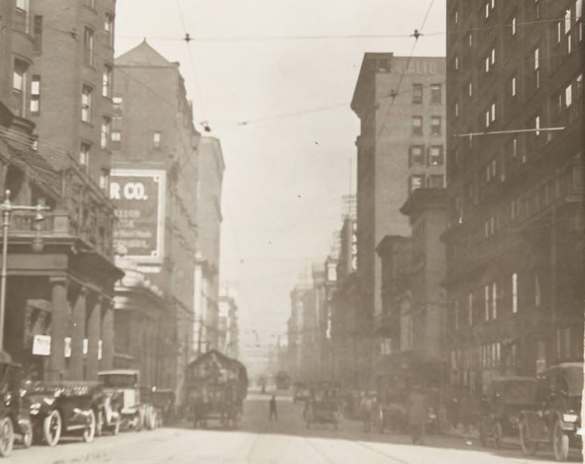 #97 Automobiles and horse-drawn carts in traffic on Fourth Street downtown, 1920