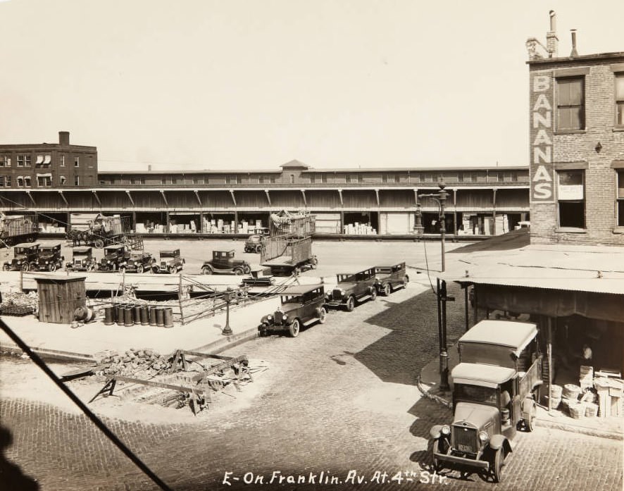 #103 Wholesale food distribution center at Franklin Avenue and 4th Street with a “Bert Offutt Wholesale” sign in the window of the “bananas” building, 1920