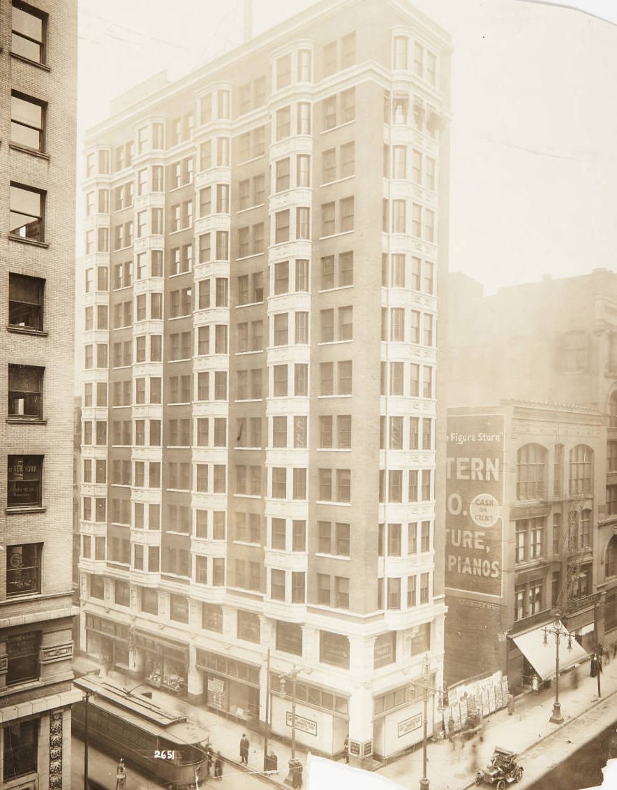 #105 Building on the northwest corner of North Broadway and Olive Street with La Salle Candy Shop and Mills and Averill Tailors occupying the ground and second floors, respectively, 1920