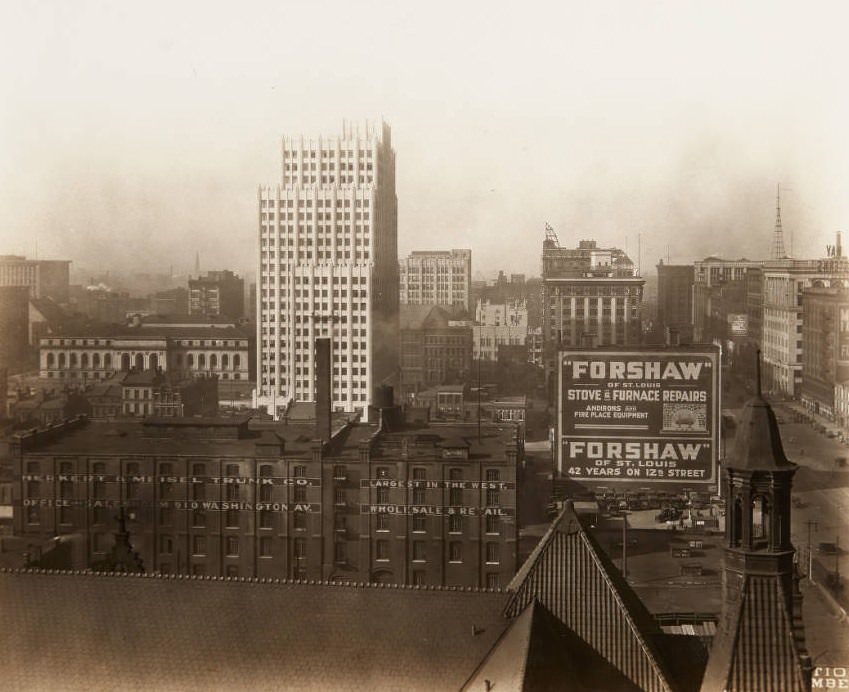 #115 View of Central Library and the Park Pacific building from the roof of City Hall with Herkert & Meisel Trunk Co. and Forshaw Stove Repairs buildings in the foreground, 1920