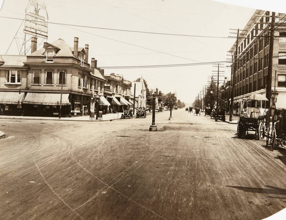 #124 Intersection of Kingshighway and Delmar in 1920, with a billboard advertising for Talbot’s Hippodrome atop one of the buildings.