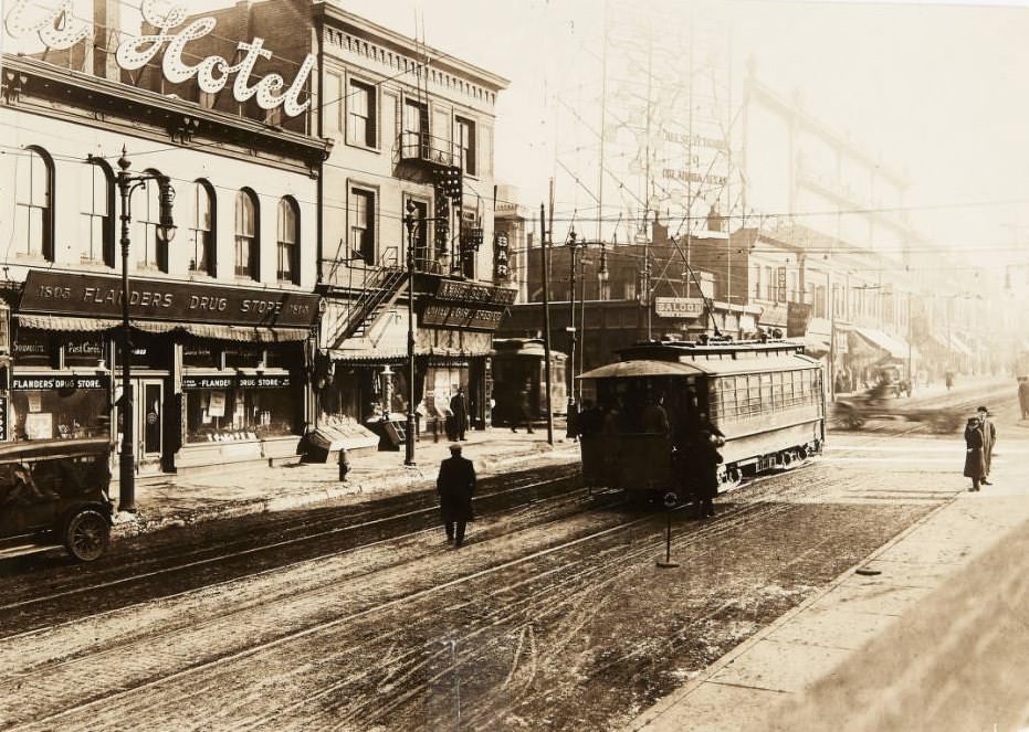 #127 A streetcar rolling along Market Street near its intersection with 18th Street in 1920. Flanders Drug Store, Travelers Hotel, and United Cigar Stores Co. can be seen in the background.