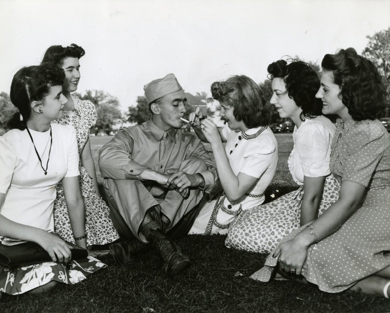 #20 Private Russell Morrison and young ladies at Jefferson Barracks’ open house, 1941.