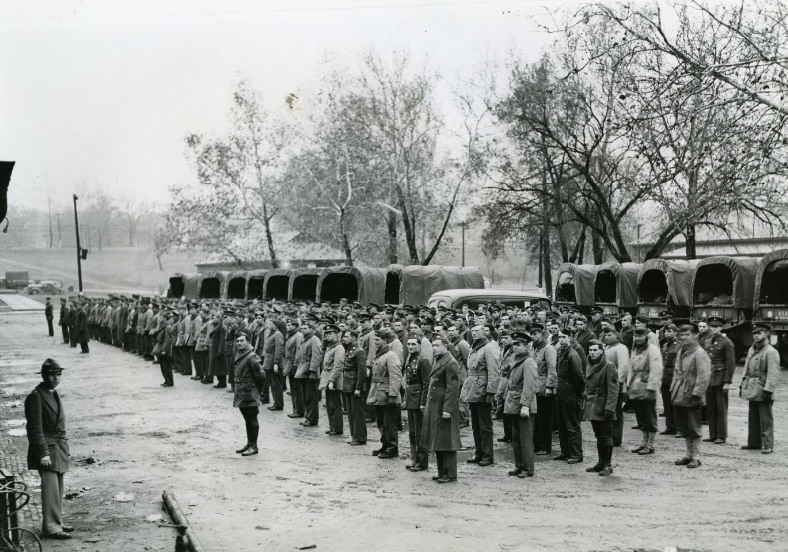 #27 Regular army arrivals from Des Moines being checked in at Jefferson Barracks, 1940.