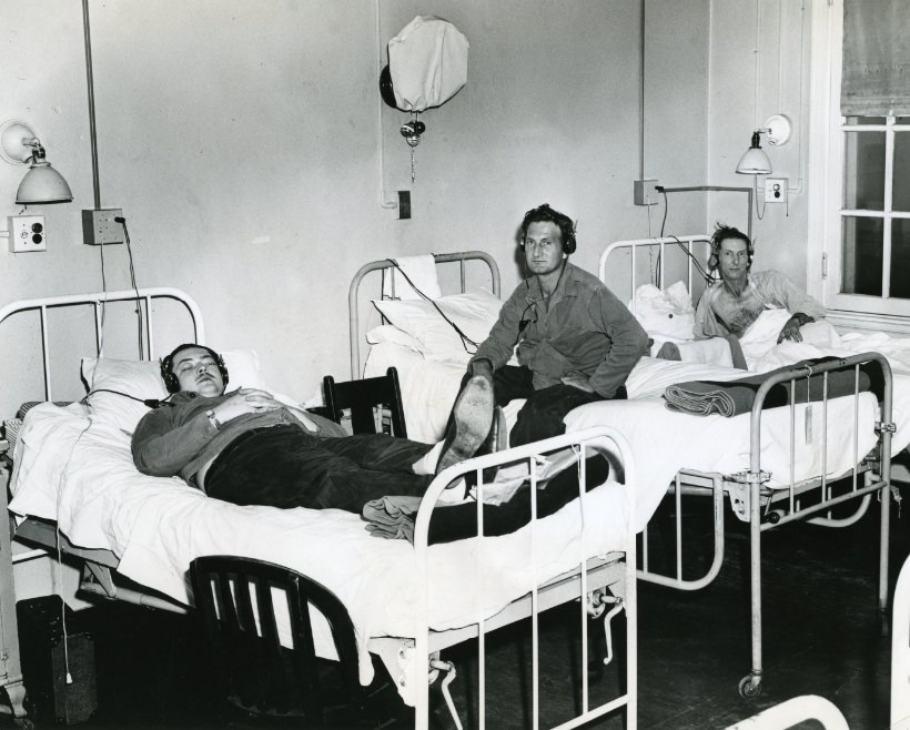 #40 Veteran’s Hospital patients with earphones at their beds, 1949.