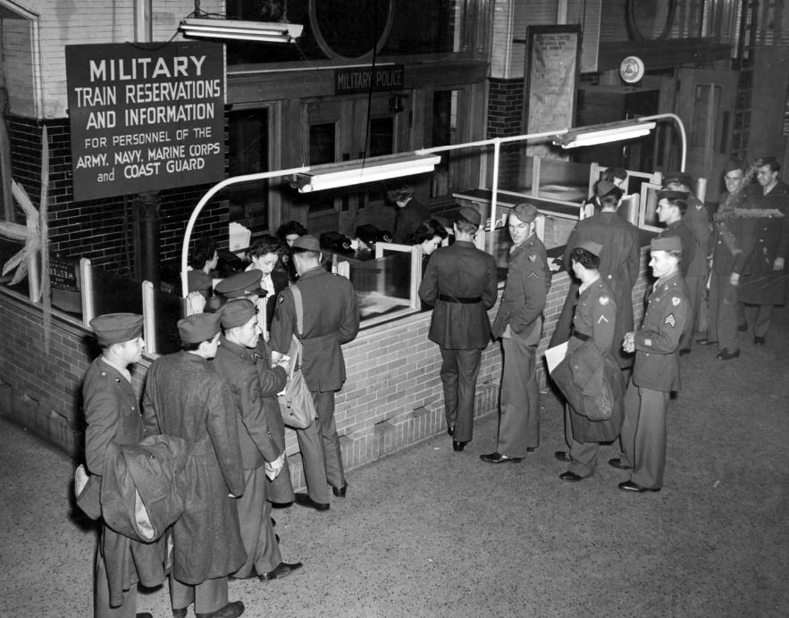 #51 Soldiers gather at Union Station before the booth maintained by the Military Reservation Bureau to handle ticket matters for all servicemen on official business, 1944