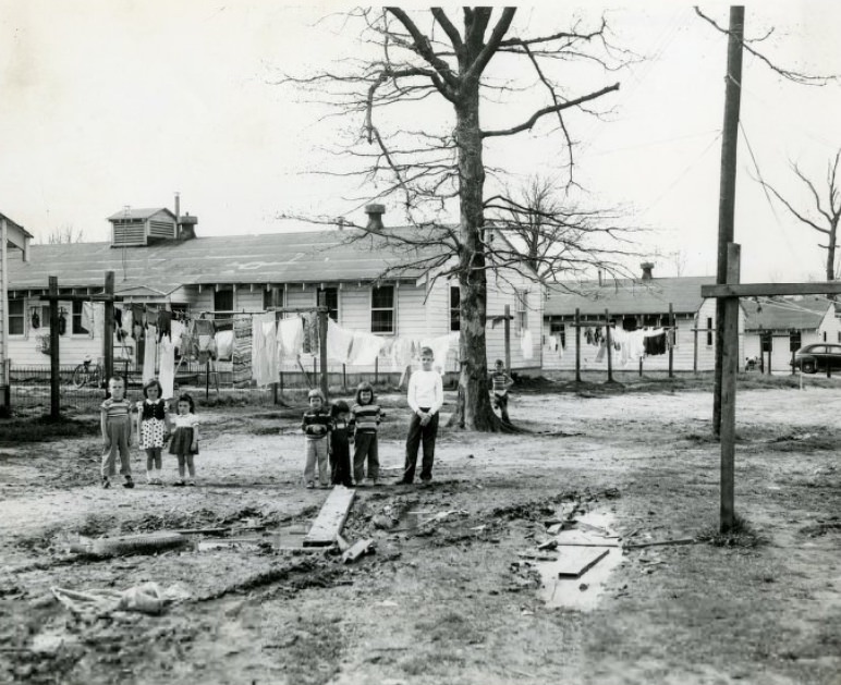 #100 A mud hole, attended by children, in the rear of 1100 block of Scott next to Jefferson Barracks, 1955