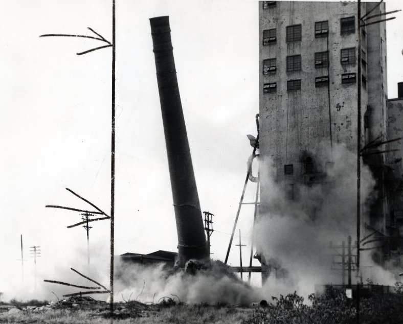 #126 Burlington Grain Elevator – On Its Way Down, 1954