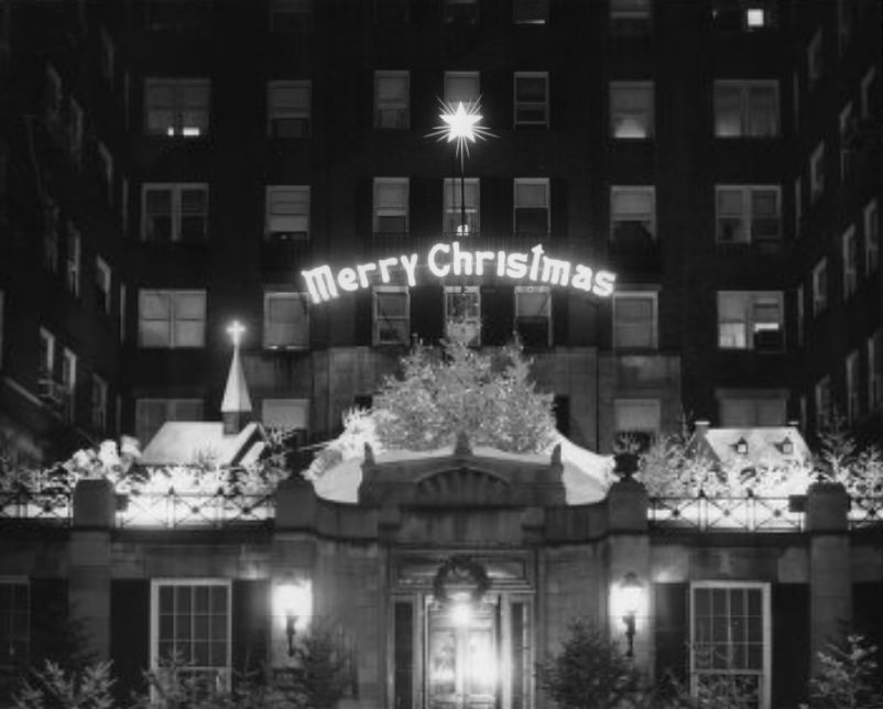 #169 A winter scene with an animated Santa Claus and reindeer at the Winston Churchill Apartments, 1957