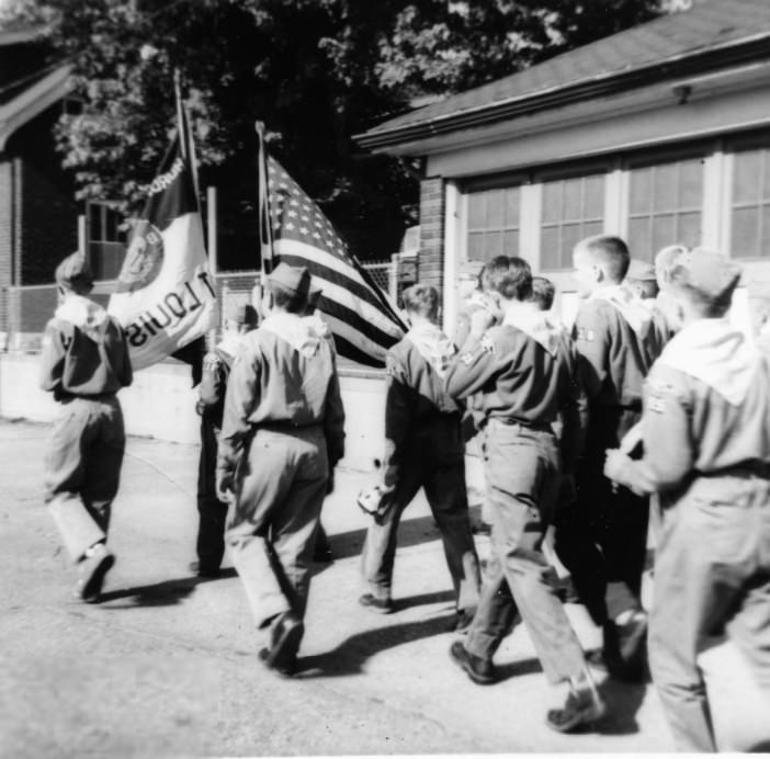 #70 The St. Mary Magdalen Boy Scout troops march in the school parade, June, 1955.