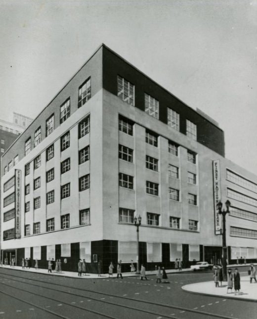 #228 The building of the First National Bank with people passing it by, 1950