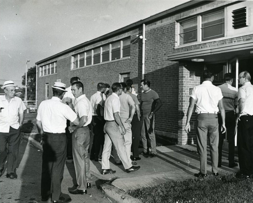 #115 Iron workers going into the Iron Workers Union Hall for a meeting, 1960
