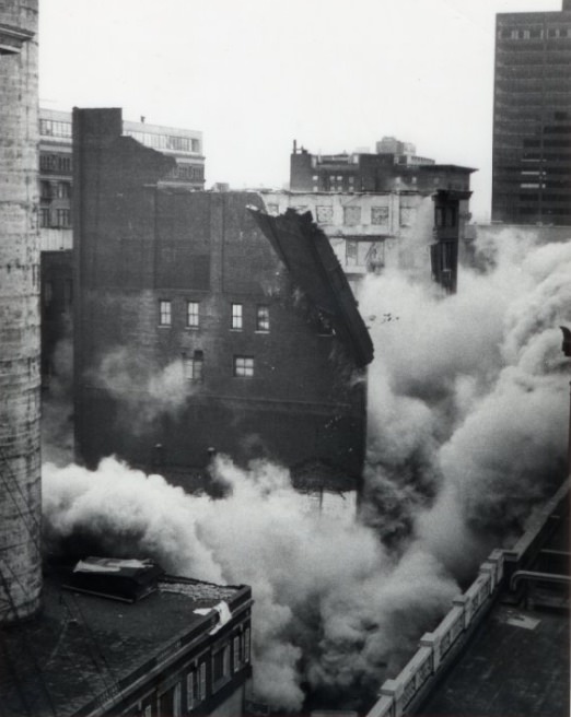 #148 Smoke surfaces as the building begins to dismantle, 1972
