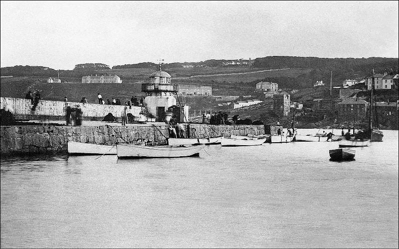 #13 A view of Smeaton’s Pier at high water. The Pedn Olva mine engine house can be clearly seen as well as the Malakoff (the disused engine house was used an artists studio for a period), St. Ives, Cornwall
