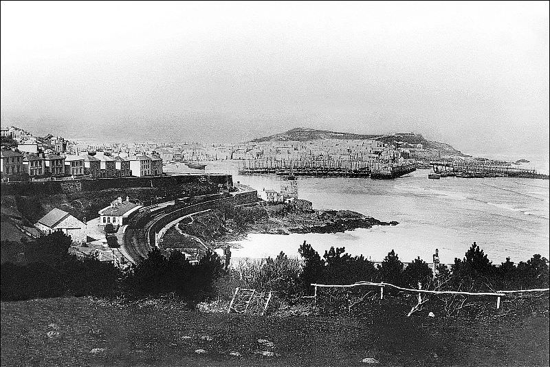 #23 A view of the town and harbour. The track at the station appears to be broad gauge, the St. Erth branch line was the very last broad gauge line to be built, St. Ives, Cornwall