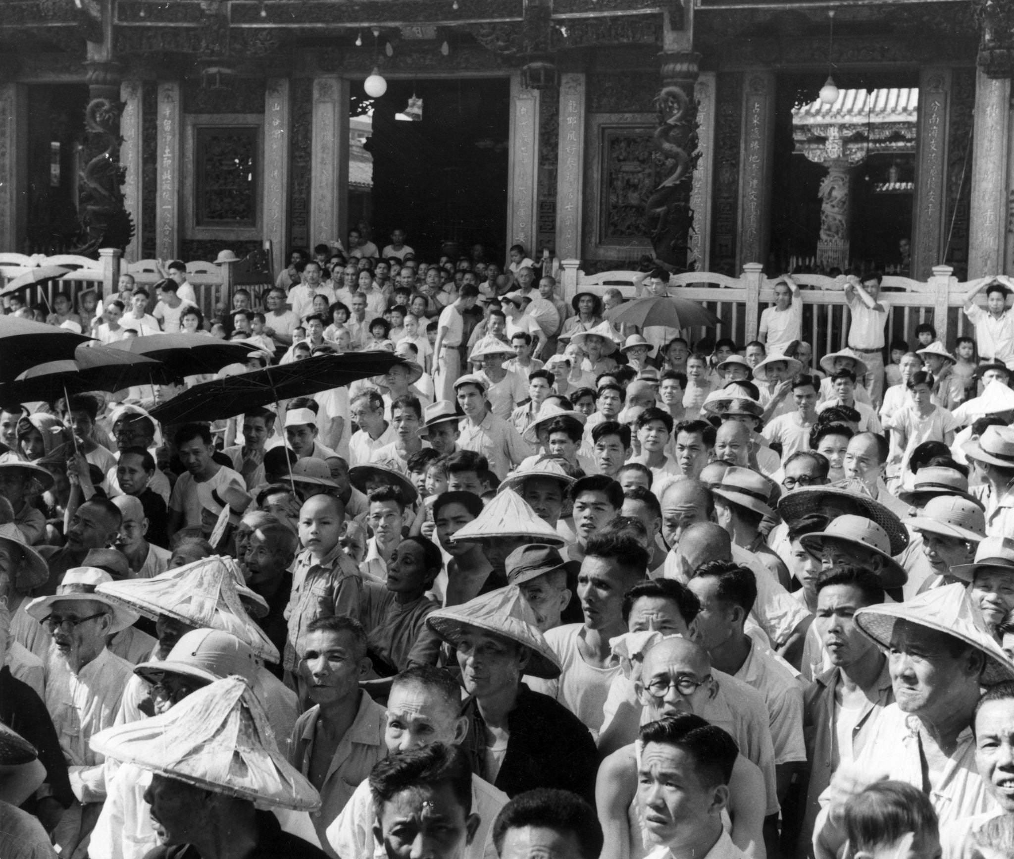 #4 A crowd watching a performance of Chinese opera by a traveling theater company at Taipei, Taiwan, 1955