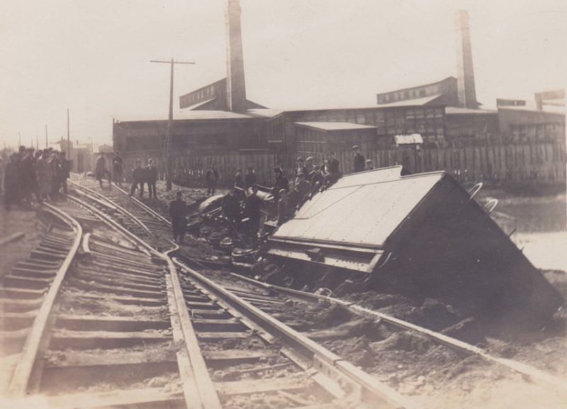 #36 Railroad engine accident after tracks undermined, looking at Pocock Glass Factory, Massillon, Ohio, 1913