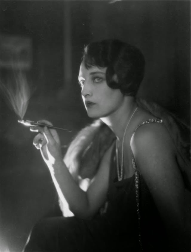#14 Glamorous Australian dancer Dorothy Blanchard smoking a cigarette, 1925.