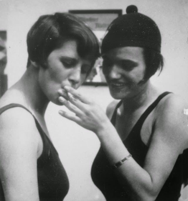 #5 Two girls sharing a cigarette after a swim, 1925.