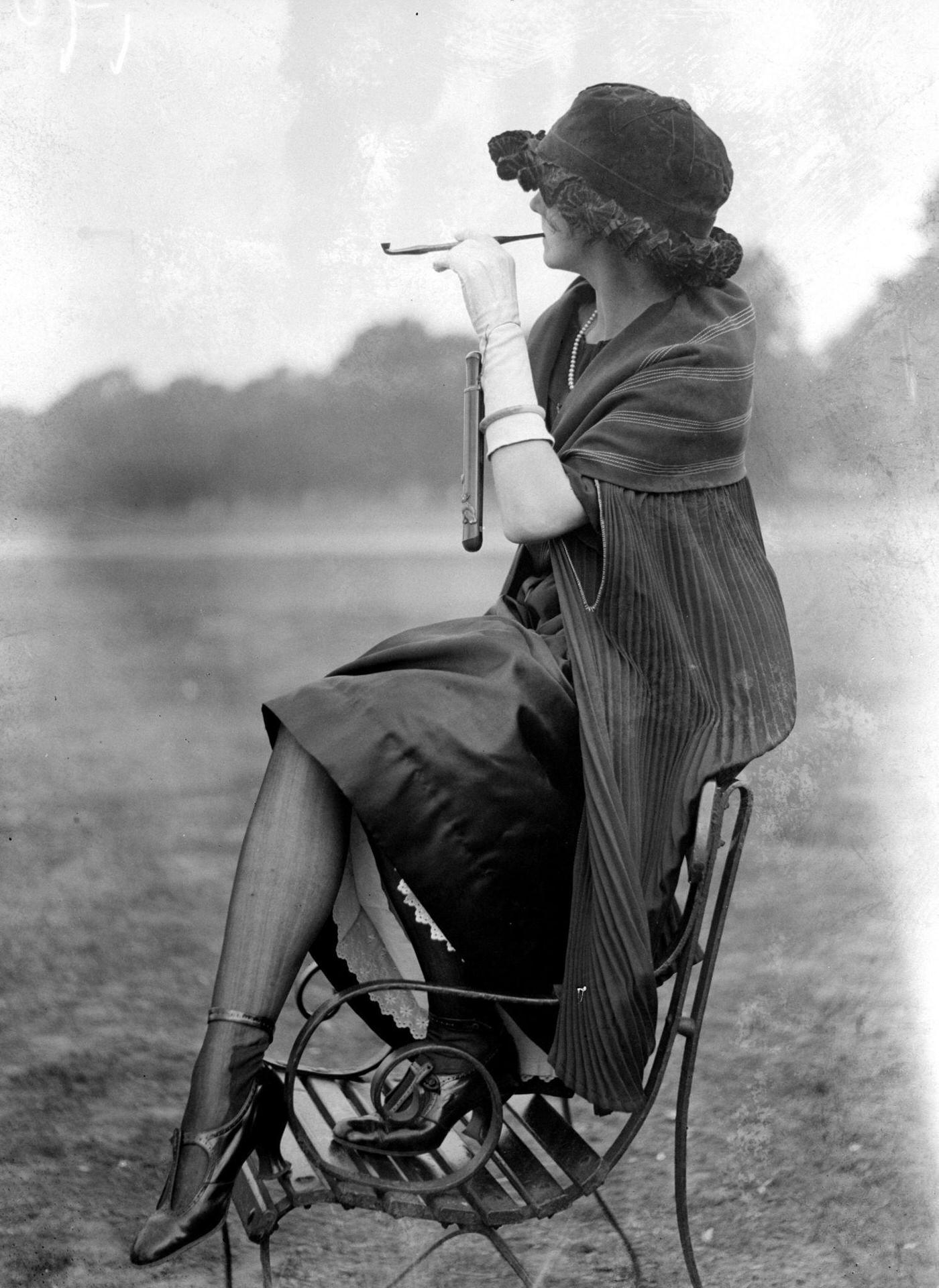 #32 Pipe Fashions, 1924: A Woman Balancing on a Bench, Delicately Smoking