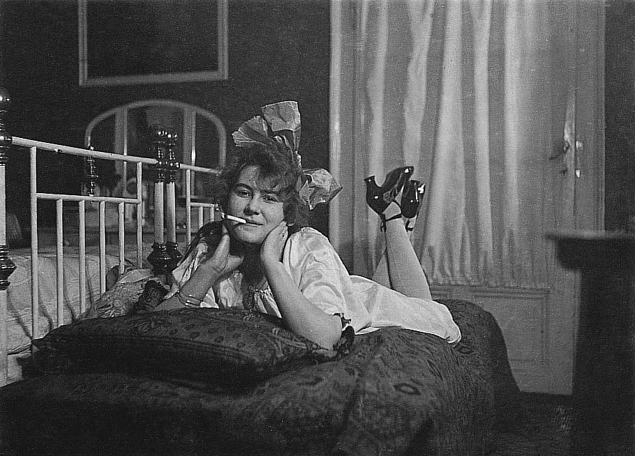 #35 Woman with Cigarette Poses on a Sofa, 1925: Captivating and Timeless