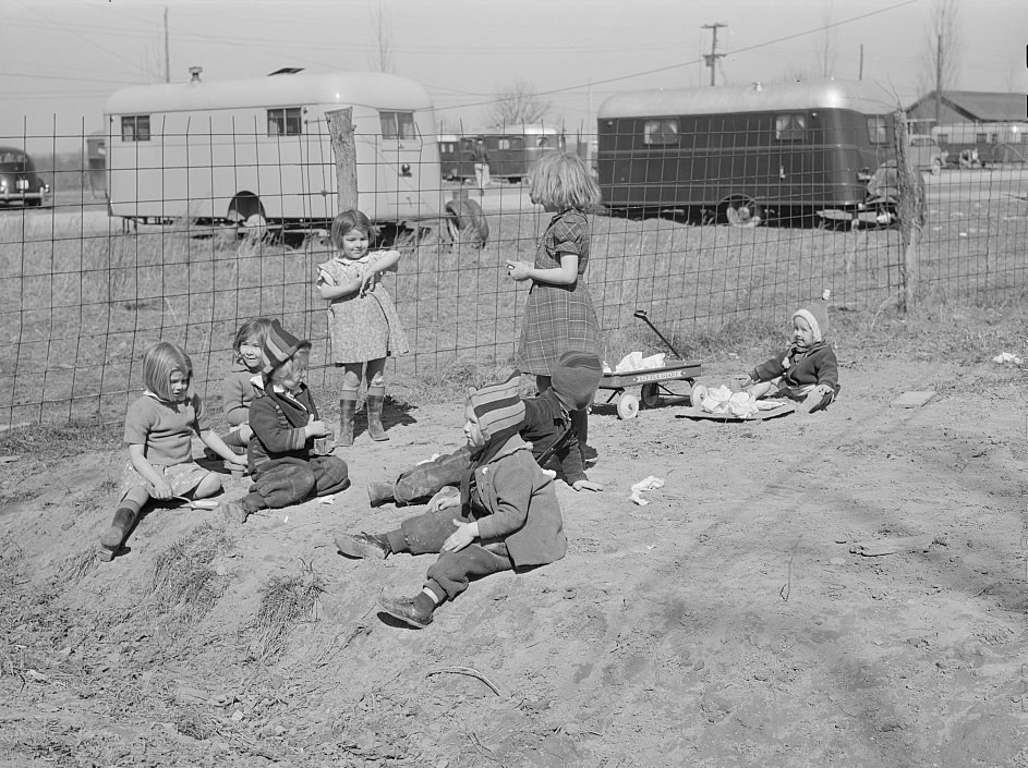 #7 Children of defense workers playing in “their backyards.” Trailer camp, Mount Vernon Highway, Alexandria, 1941